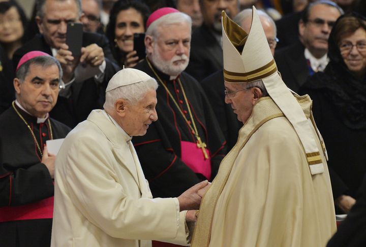 Pope Francis, right, greets Pope Emeritus Benedict XVI at St. Peter's Basilica on Feb. 14, 2015.