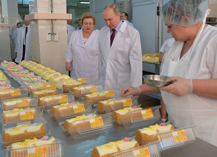 Putin and some presumably delicious cakes.