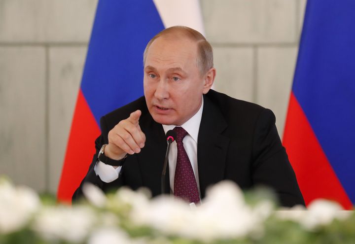Boris Johnson has blamed Russian President Vladimir Putin, seen above in St Petersburg, Russia, on March 16