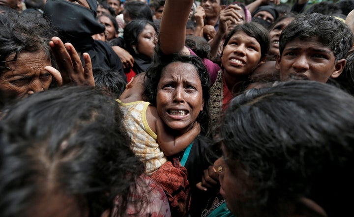 Rohingya refugees wait to receive aid in Bangladesh on Sept. 21, 2017. 