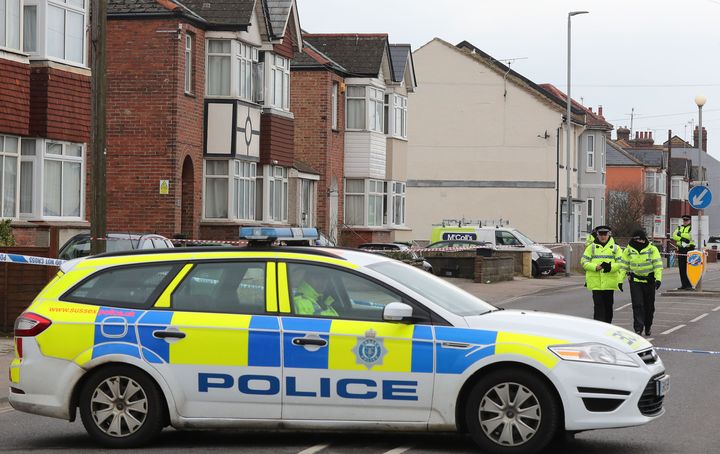 Police at the scene where two women were shot dead at a house in St Leonards, East Sussex.