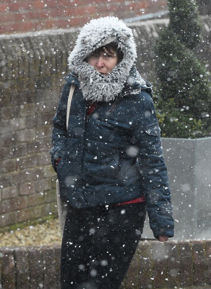 A woman walks in the snow in Salisbury, Wilts, during the 'mini beast from the east' storm.