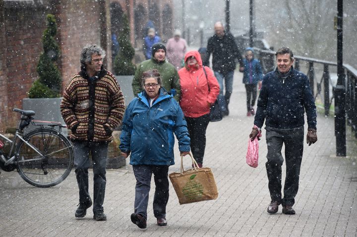 People walk in the snow near The Maltings in Salisbury on Saturday morning.