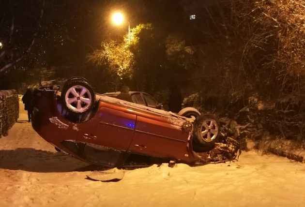 West Yorkshire Police tweeted a picture of an overturned car on Healthy Lane, Halifax. The road was closed due to two separate collisions, the force said. 