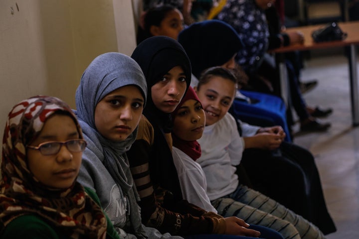 Nada, 14, (left) says Cairo girls who speak out about harassment are blamed