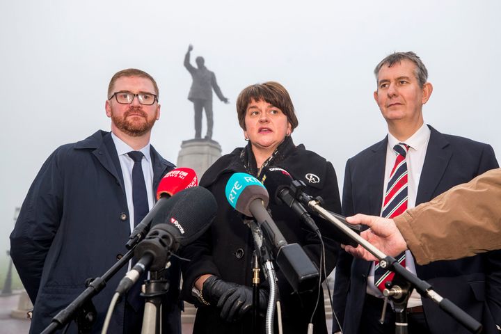 DUP leader Arlene Foster, with party colleagues Simon Hamilton and Edwin Poots (right), speaks with media at Carson Statue after talks with the new Secretary of State for Northern Ireland Karen Bradley at Stormont House.
