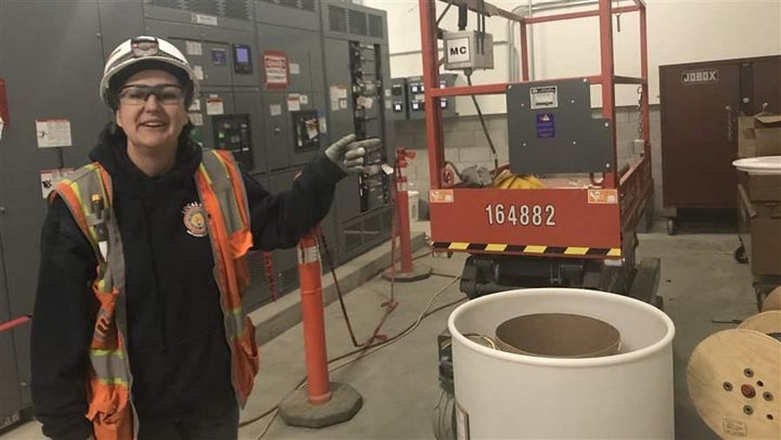 Sara Glascock, an electrician’s apprentice, stands at her job site at the San Francisco International Airport. For women, breaking into construction can be tough. “Pre-apprenticeships” can give them an extra edge.