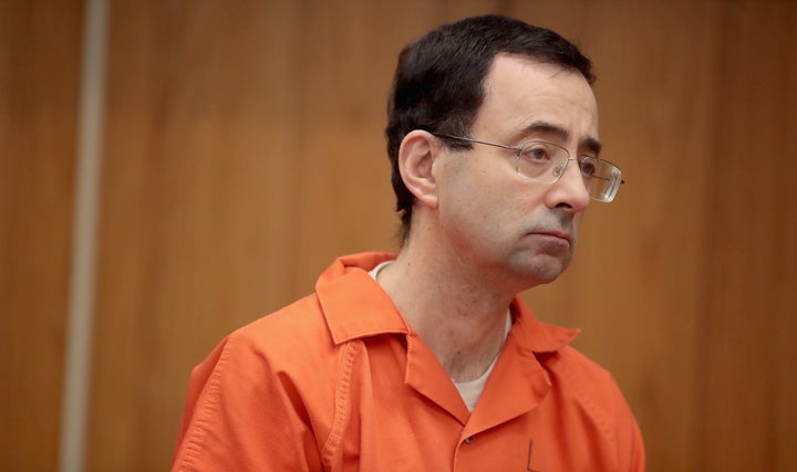 Larry Nassar stands during his third sentencing hearing on Feb. 5 in Charlotte, Michigan. His former boss