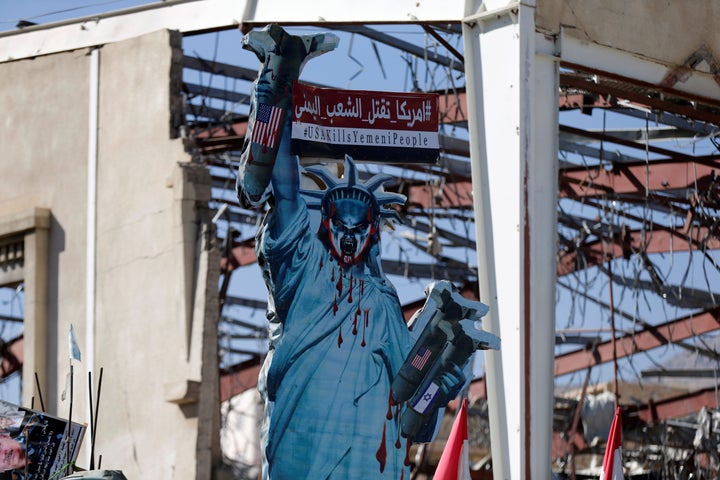 A protest sign outside a funeral hall in Sanaa, Yemen, that was hit by the Saudi-led coalition that receives U.S. support.