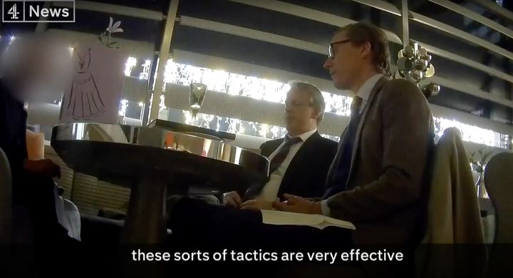 Cambridge Analytica's Alexander Nix and Mark Turnbull are seen during a secretly recorded interview with a Channel 4 reporter.