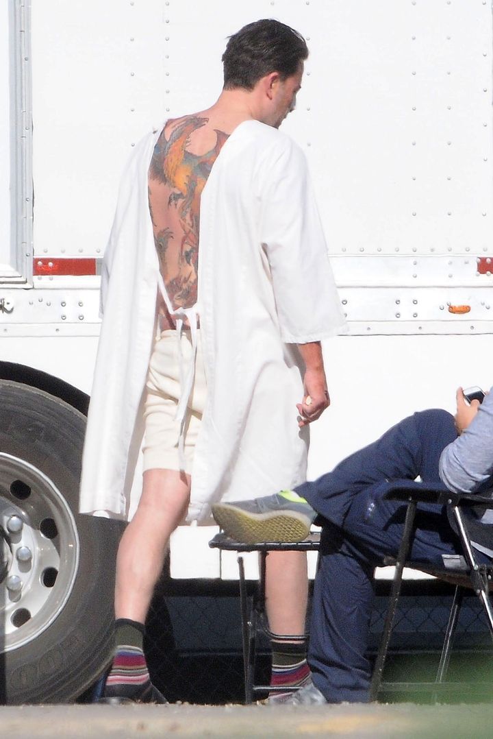 Affleck reveals his tattoo on the set of "Live By Night" on Dec. 8, 2015. 