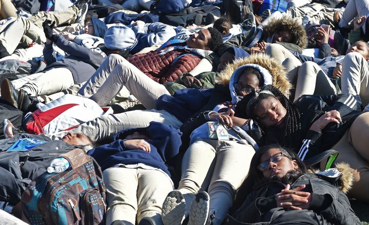 Students at Baltimore Polytechnic Institute stage a "lie-in" for 17 minutes on March 14 to memorialize the 17 lives lost in the Parkland, Florida, shooting. Students walked out of schools across the country to mark one month since the massacre. The March for Our Lives in Washington, D.C., scheduled for March 24, is expected to draw a broad range of participants.