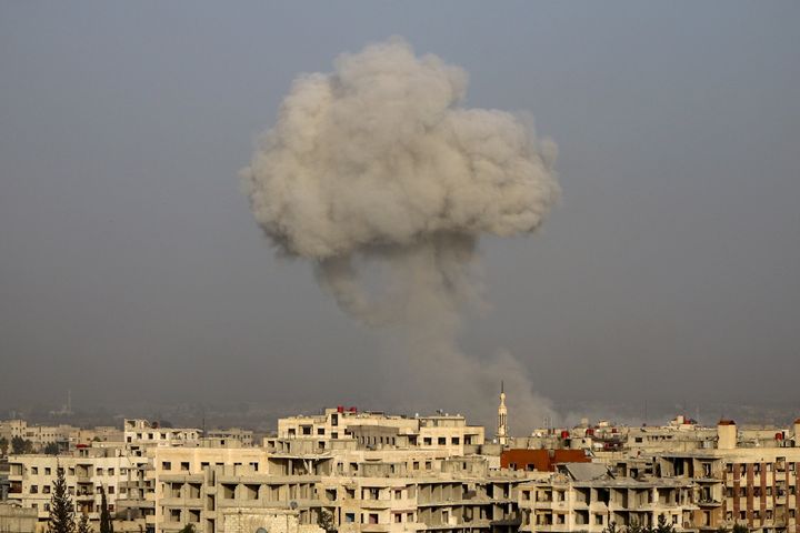 Smoke rises after airstrikes on eastern Ghouta's town of Kafr Batna in Syria on Friday.