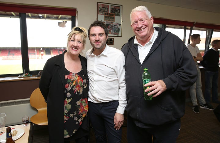 George with his mum Linda and step-dad Pete