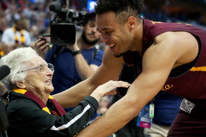 Sister Jean Dolores-Schmidt and Marques Townes celebrate Loyola University Chicago's upset victory over the University o