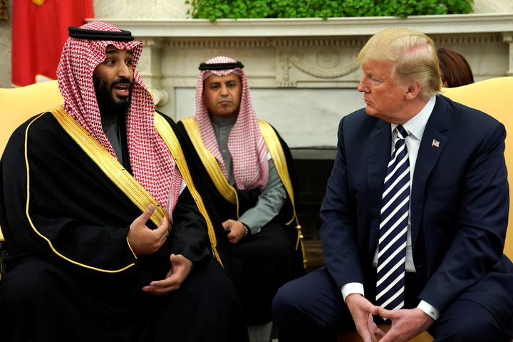 Saudi Arabia's Crown Prince Mohammed bin Salman speaks to U.S. President Donald Trump in the Oval Office at the White House on March 20, 2018.