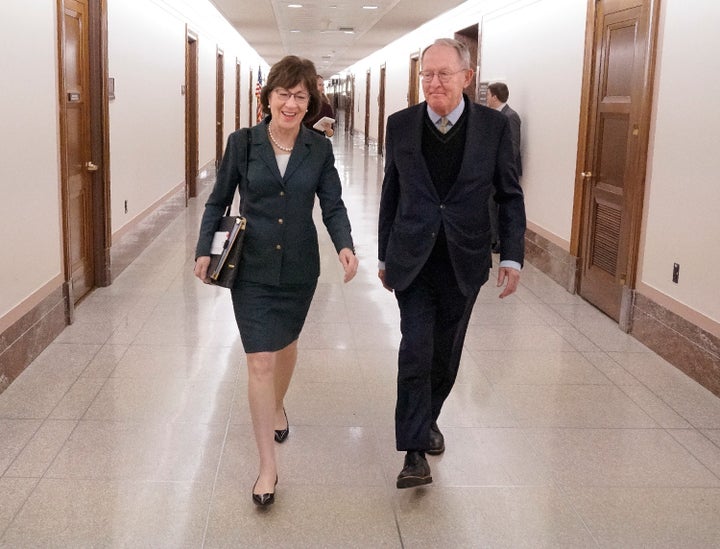 Sen. Susan Collins (R-Maine) walks with Sen. Lamar Alexander (R-Tenn.) after a hearing on Capitol Hill on Dec. 12, 2017.