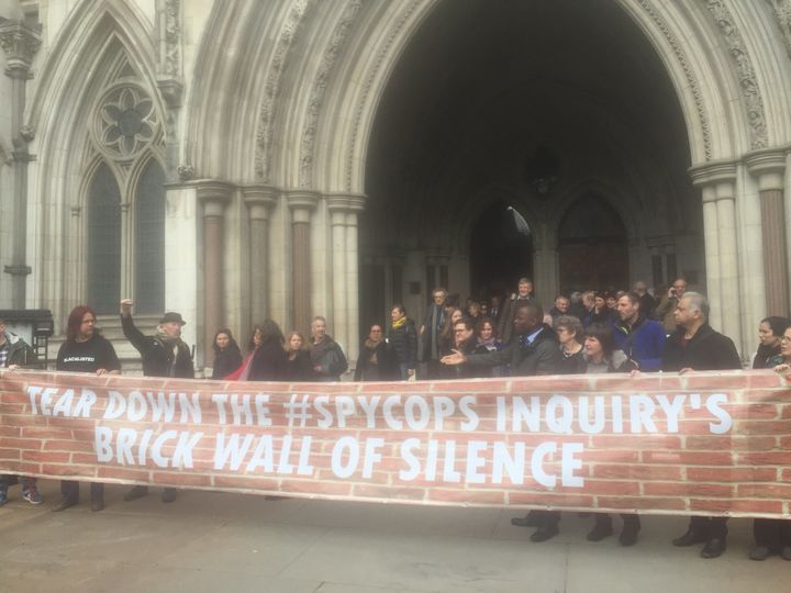 Campaigners and core participants outside the Royal Court of Justice after walking out of the Inquiry into Undercover Policing 