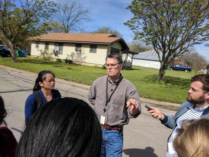 Mark Roessler, center, who lives across from Mark Conditt's house in Pflugerville, said he saw a man being taken into custody outside the home on Wednesday.