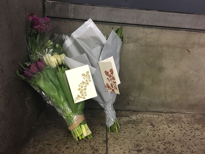 Flowers and cards from Labour leader Jeremy Corbyn and staff, left at Westminster Underground station close to the entrance to Parliament where the man died 