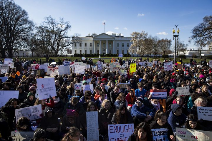 Students sit for 17 minutes in silence with their backs to the White House on March 14 in memory of the 17 people killed at Marjory Stoneman Douglas High School.