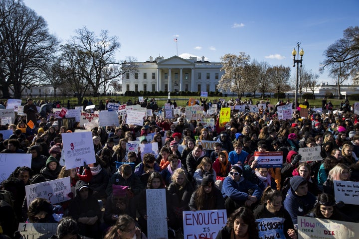 Students sit for 17 minutes in silence with their backs to the White House on March 14 in memory of the 17 people k