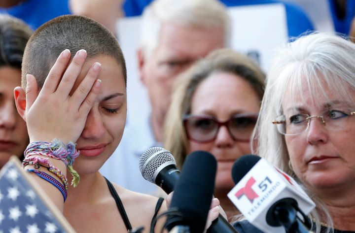 Emma González gets emotional during her speech at a rally for gun control three days after the shooting at her school.
