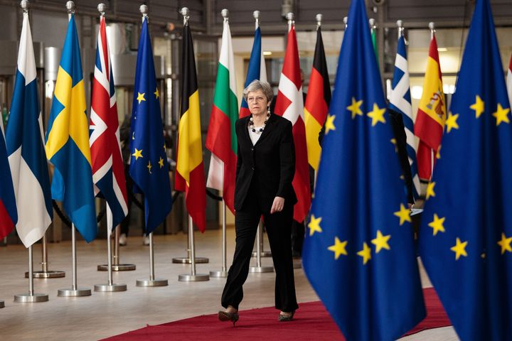 Theresa May arrives at the Council of the European Union on the final day of the European Council leaders' summit