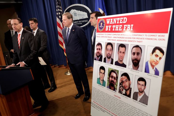 U.S. Deputy Attorney General Rod Rosenstein speaks at a news conference with other law enforcement officials at the Justice Department to announce nine Iranians charged with conducting massive cyber theft campaign, in Washington, U.S., March 23, 2018. 