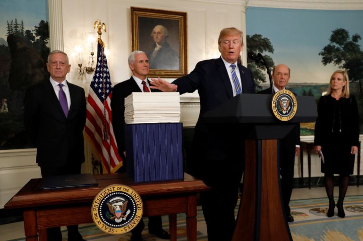 President Donald Trump talks about Congress' $1.3 trillion spending bill during a signing ceremony at the White House on Friday.