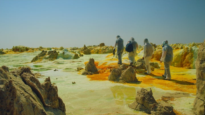 In this shot from "One Strange Rock," scientists walk through deadly acid pools near the Dallol volcano in Ethiopia. 