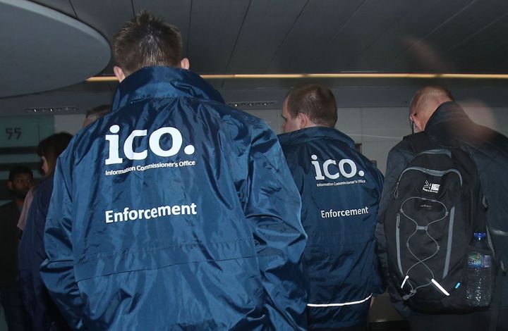 Enforcement officers working for the Information Commissioner's Office entering the offices of Cambridge Analytica in central London