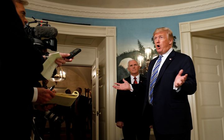 President Donald Trump speaks to reporters after signing Congress' $1.3 trillion spending bill on March 23, 2018.