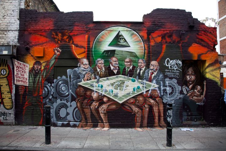 'Freedom for Humanity' a street art graffiti work by artist Mear One aka Kalen Ockerman on Hanbury Street near Brick Lane. Tower Hamlets ordered that the mural be removed as the characters depicted as bankers have faces that look Jewish, and is therefore antisemitic. When the artist posted that the mural's removal had been ordered Jeremy Corbyn asked 'Why?' 