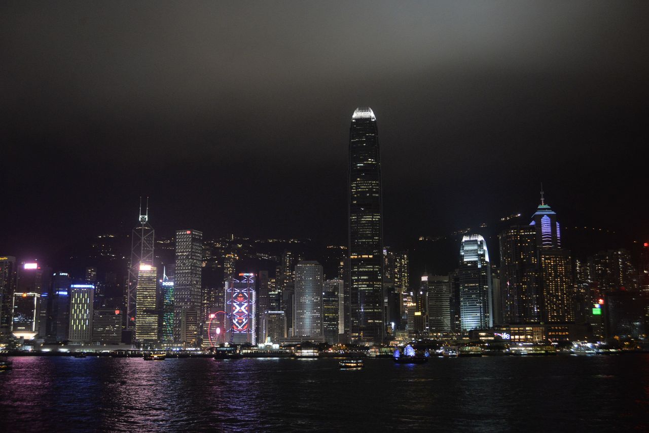 Buildings are lit up before Earth Hour along the Victoria Harbour in Hong Kong.