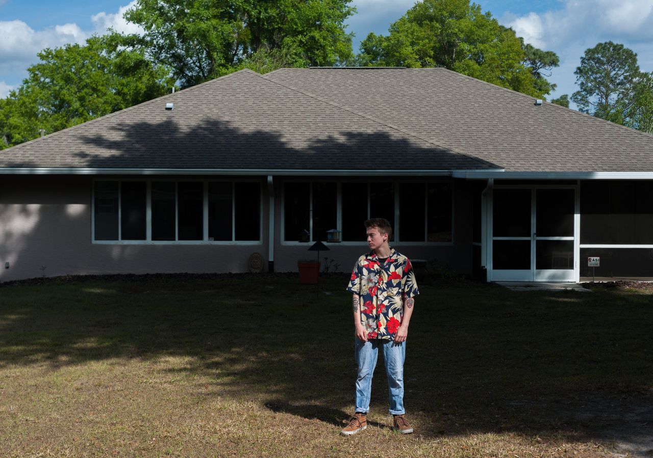 Preston Curts poses for a photo outside his home in Ocala, Florida. 