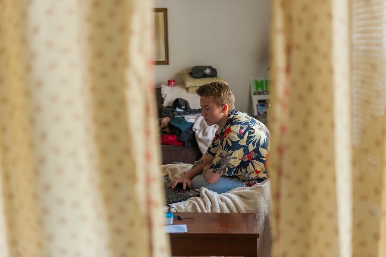 Preston Curts works on school work at his home in Ocala, Florida.