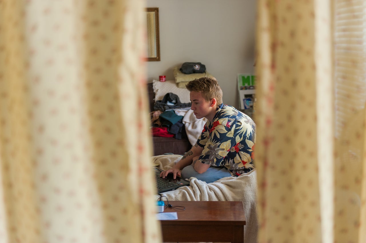 Preston Curts works on school work at his home in Ocala, Florida. 