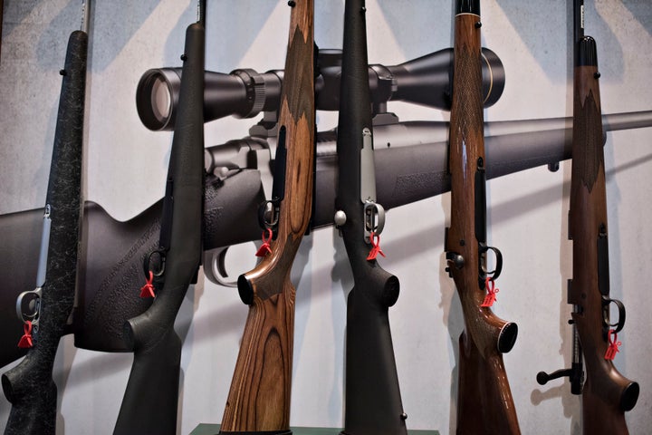 In this file photo from 2015, bolt action rifles sit on display in the Remington Arms Co. booth on the exhibition floor of the National Rifle Association Annual Meetings and Exhibits.