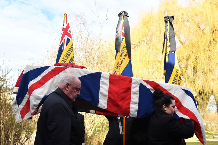 The coffin of Kenneth White, an RAF veteran who died with no known family, is carried into Cambridge City Crematorium 