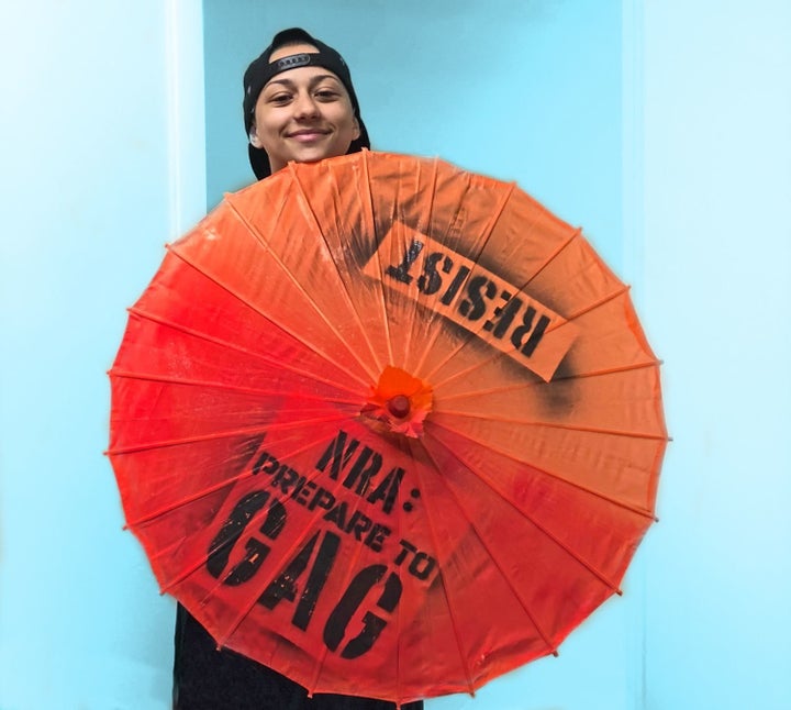 González with a parasol she was gifted by Gays Against Guns (GAG).