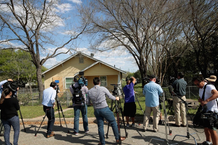 Television news crews set up outside the home of Mark Anthony Conditt following the police investigation at the property last