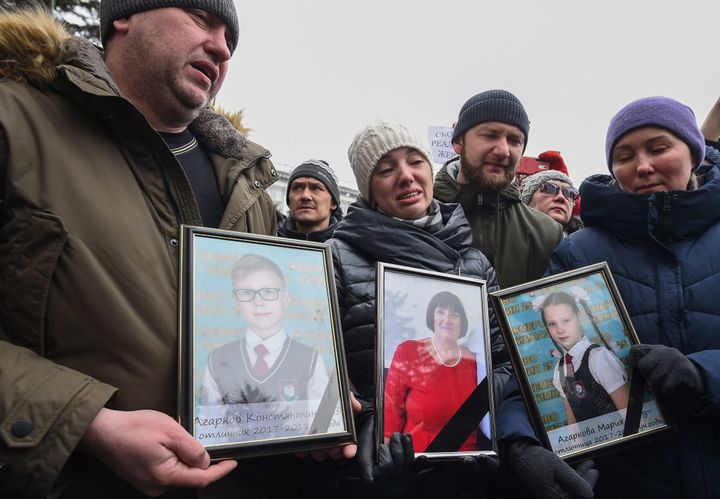 People gather to pay tribute to the victims of a fire at a shopping center in Kemerovo, Russia, on March 27, 2018.