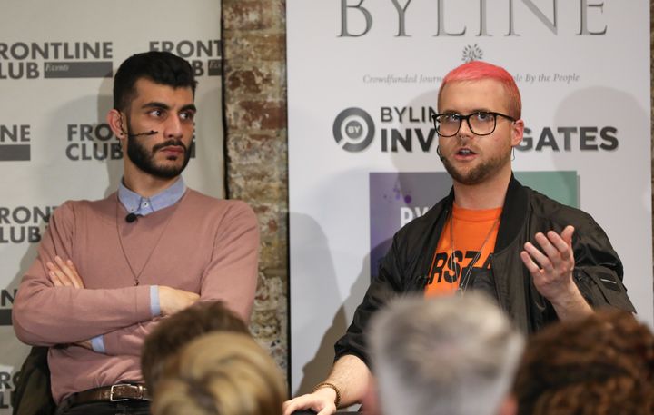 Shahmir Sanni, former volunteer for Vote Leave, left, listens as Christopher Wylie, former contractor for Cambridge Analytica, speaks during an event at the Frontline Club in London