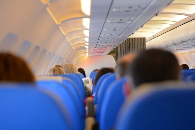 <p>The optimal distance to sit from a stranger for five hours at a time</p>