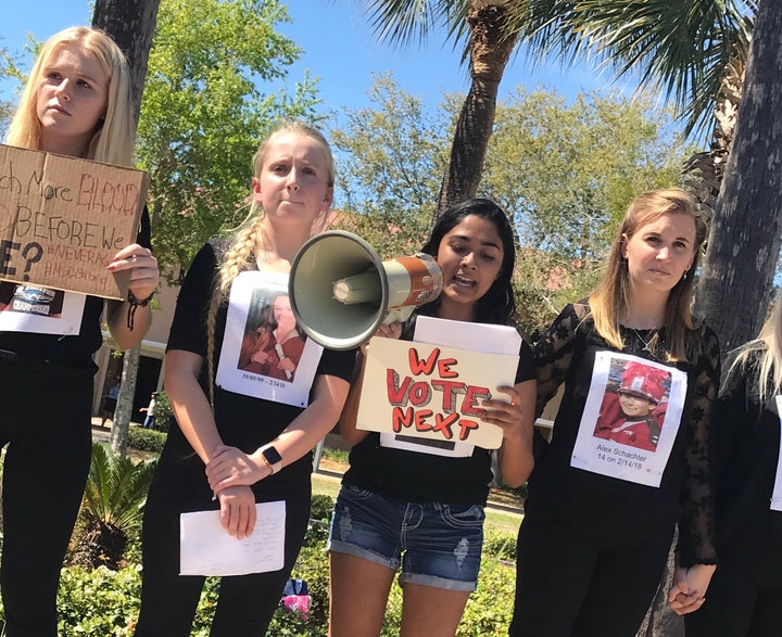 Malavika Kannan, center with megaphone, leading her high school's walkout for gun reform.