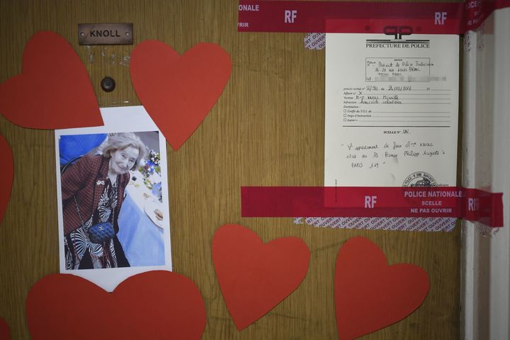 A picture taken on March 27 shows a photo of Mireille Knoll on the door of her apartment in Paris after she was found dead in her apartment on March 23 by firefighters called to extinguish a blaze.