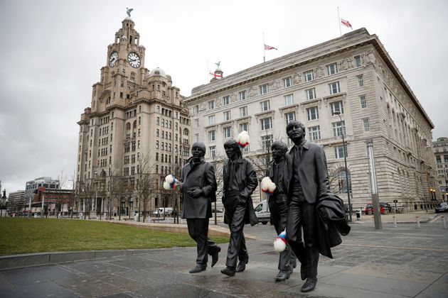 A statue of The Beatles sporting Ken Dodd's famous 'tickling sticks'.