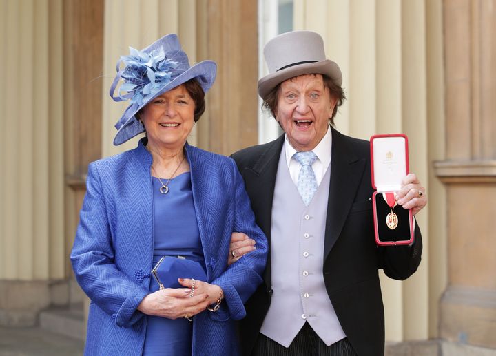 Sir Ken, with his partner, Anne Jones, at Buckingham Palace after he was made a Knight Bachelor of the British Empire by the Duke of Cambridge.
