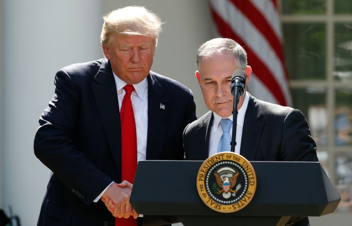 President Donald Trump invites Pruitt to the podium after announcing his decision to withdraw the United States from the Paris climate agreement on June 1, 2017.